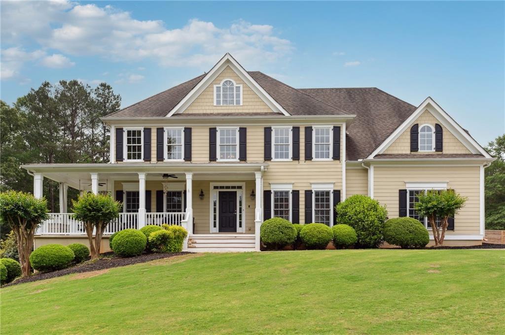 a front view of a house with a yard