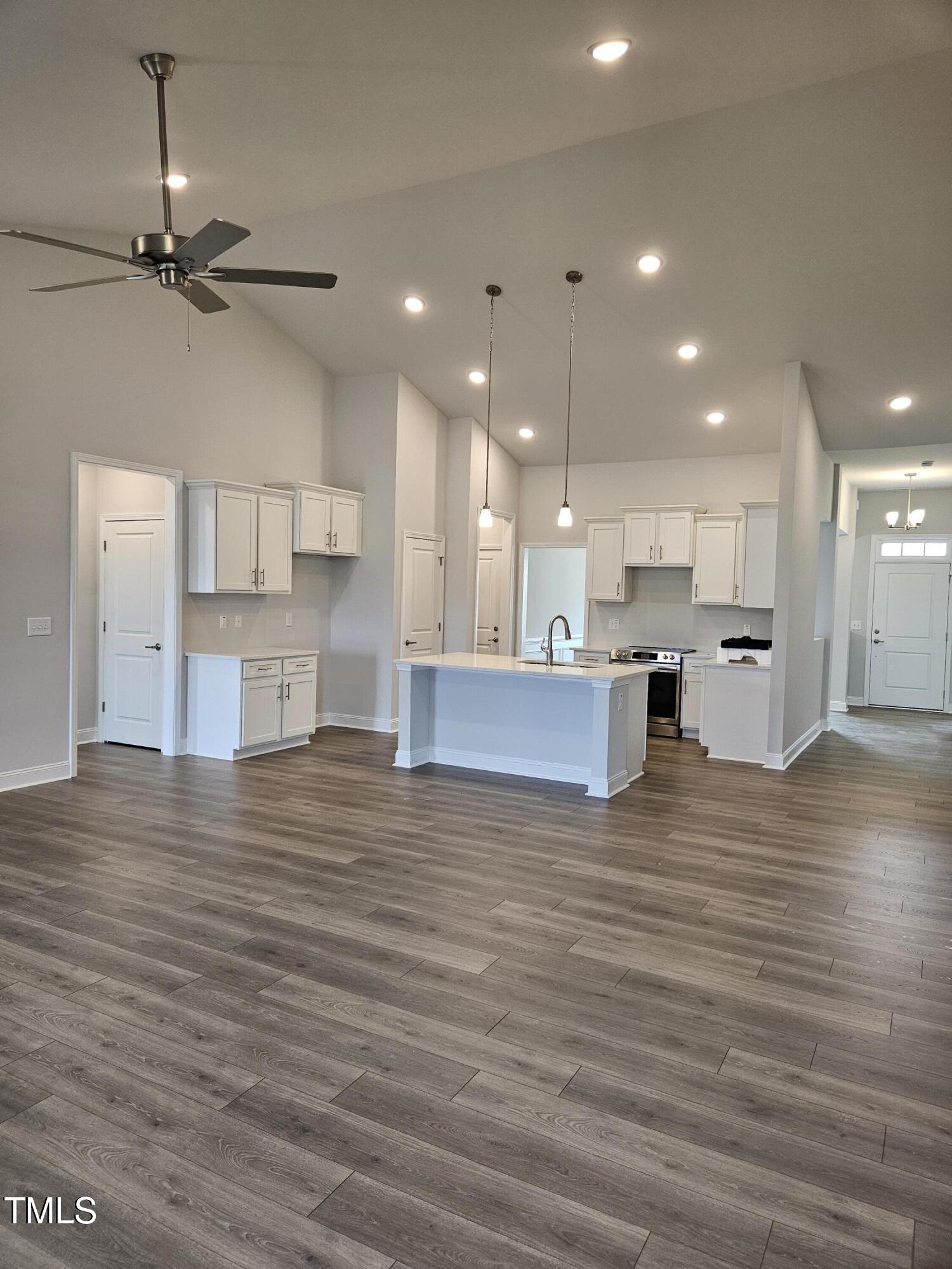 a view of kitchen view with cabinets and wooden floor