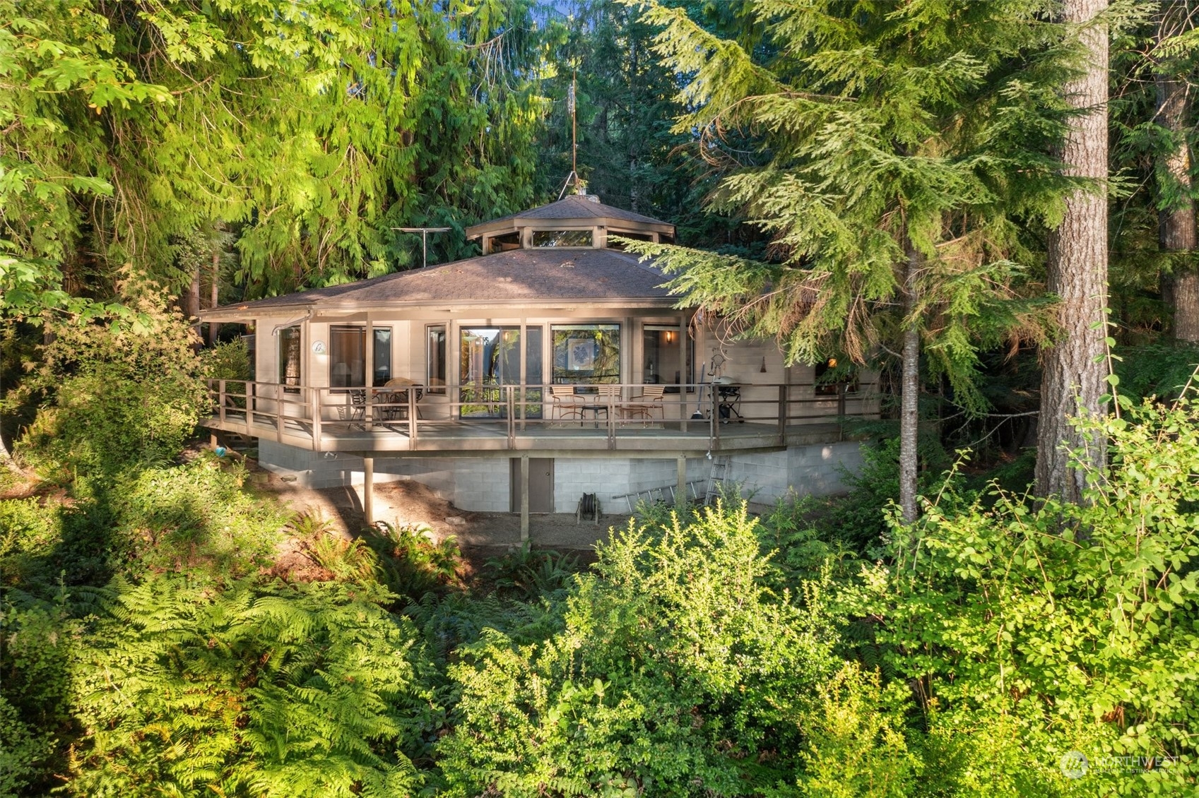 a front view of a house with yard and swimming pool