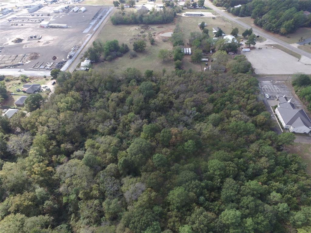 an aerial view of a houses with yard