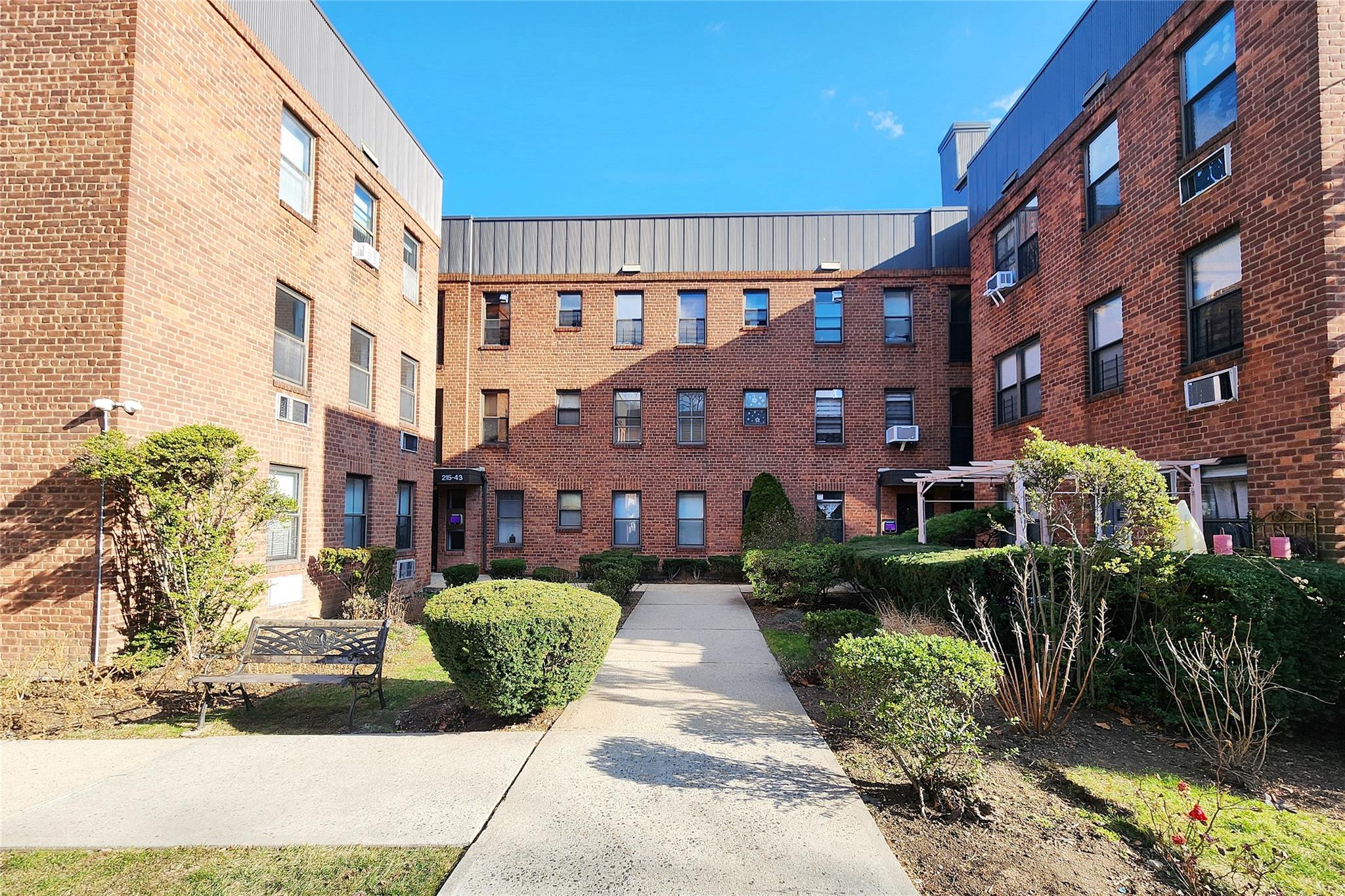 a view of a building with a garden