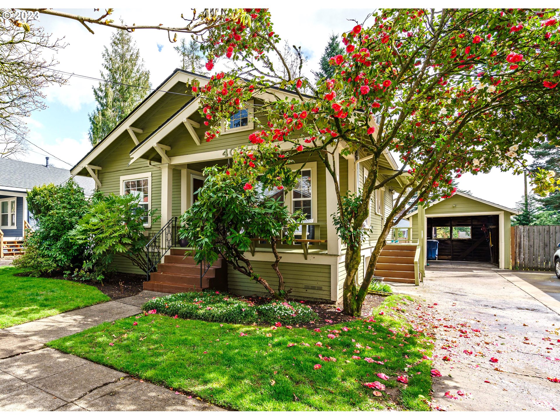 a front view of a house with garden