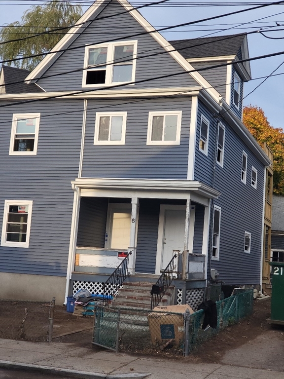 a front view of a house with garage