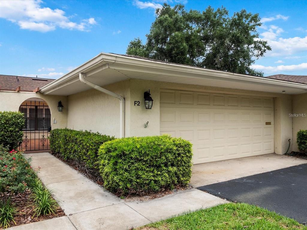 a side view of a house with a garage