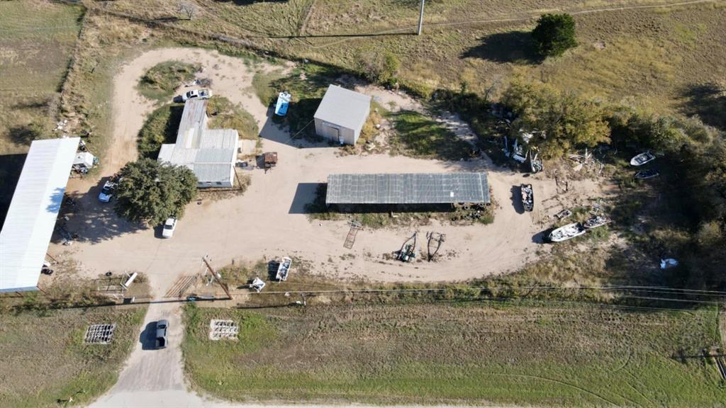 an aerial view of a house with outdoor space