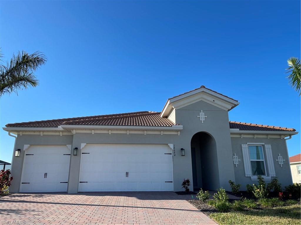 a front view of a house with a garage