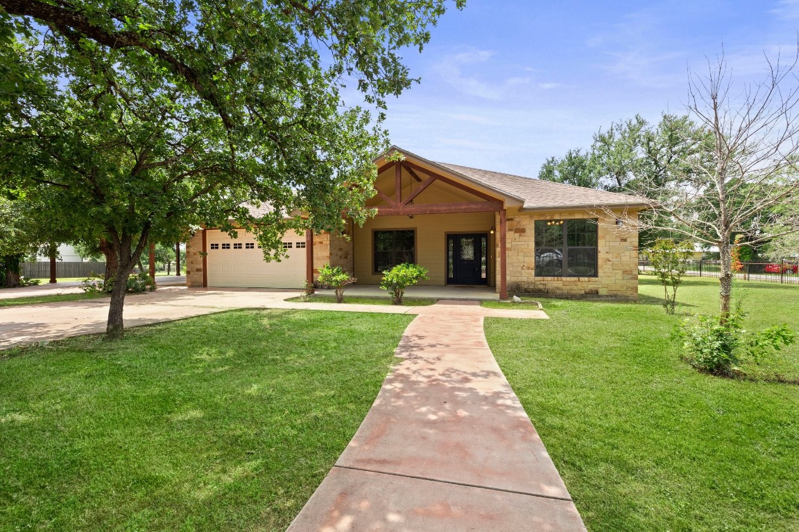 a front view of a house with a yard