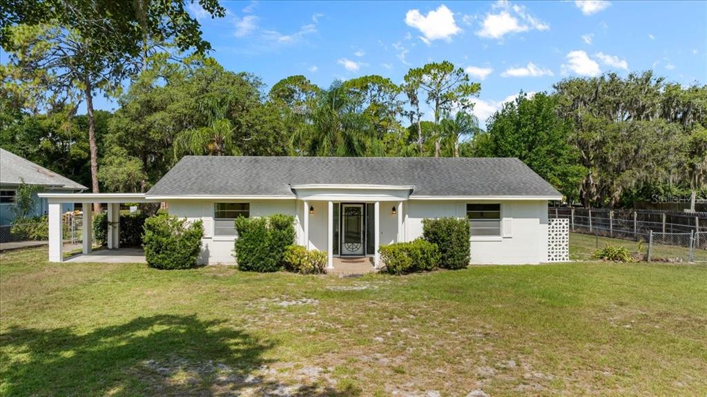 front view of a house with a yard