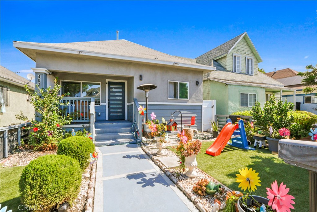 a front view of house with an outdoor space