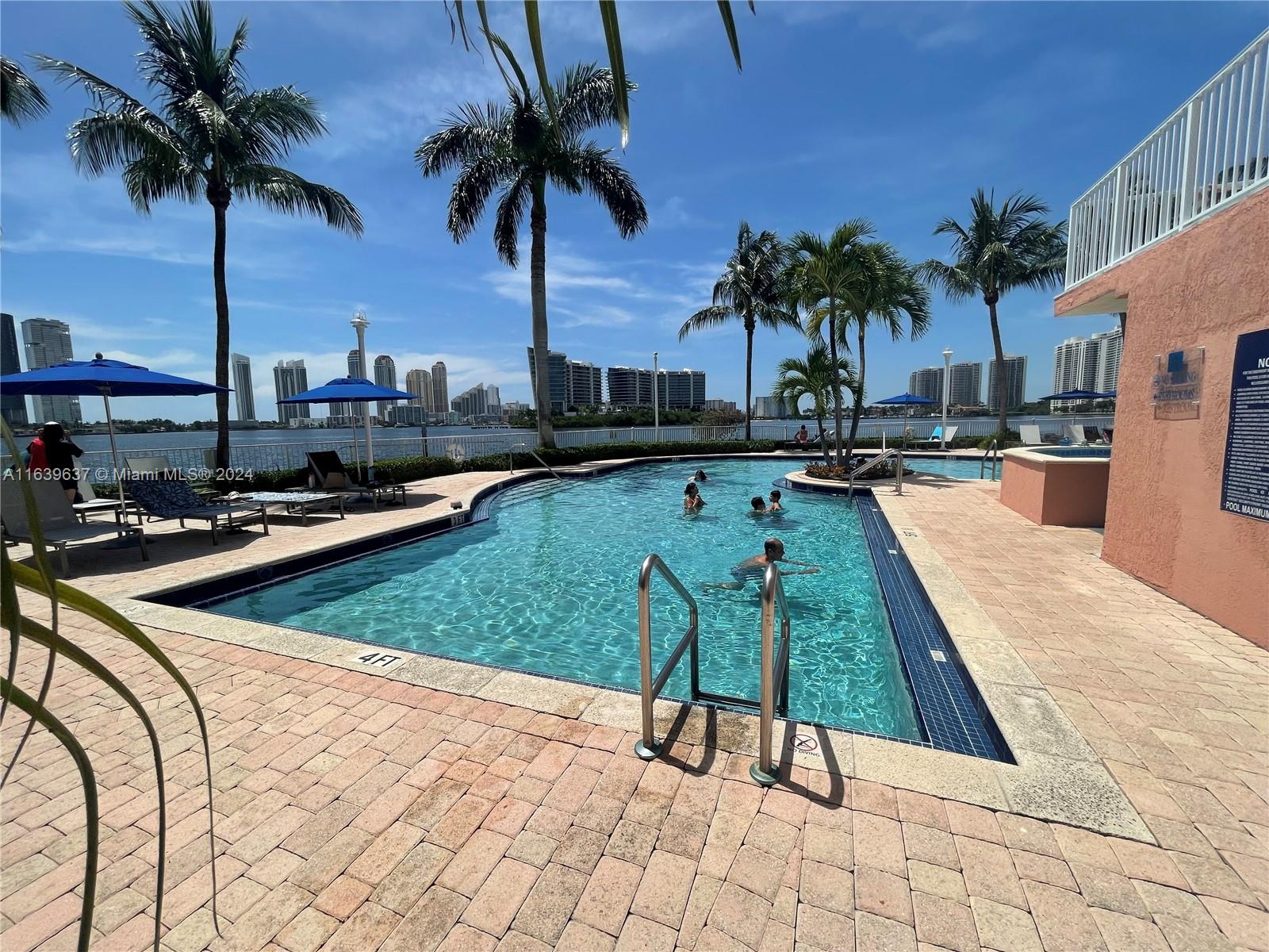 swimming pool view with a garden space