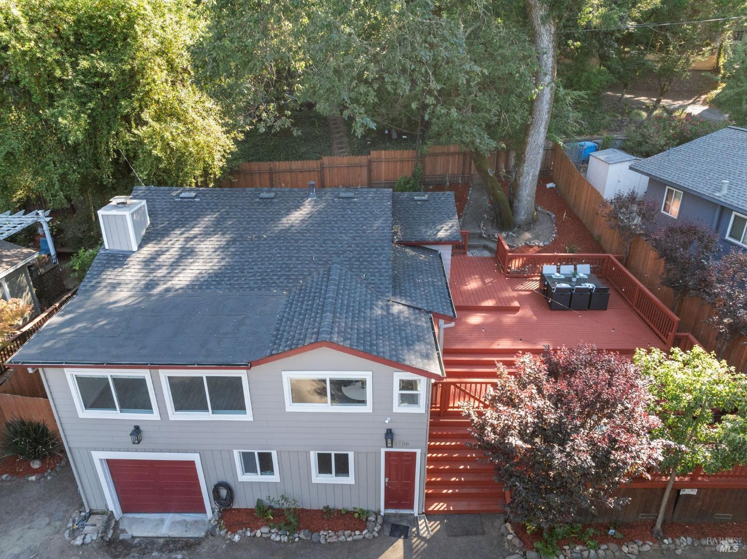 aerial view of a house with a yard