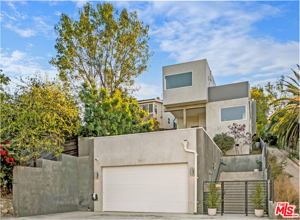 front view of a house with a garden