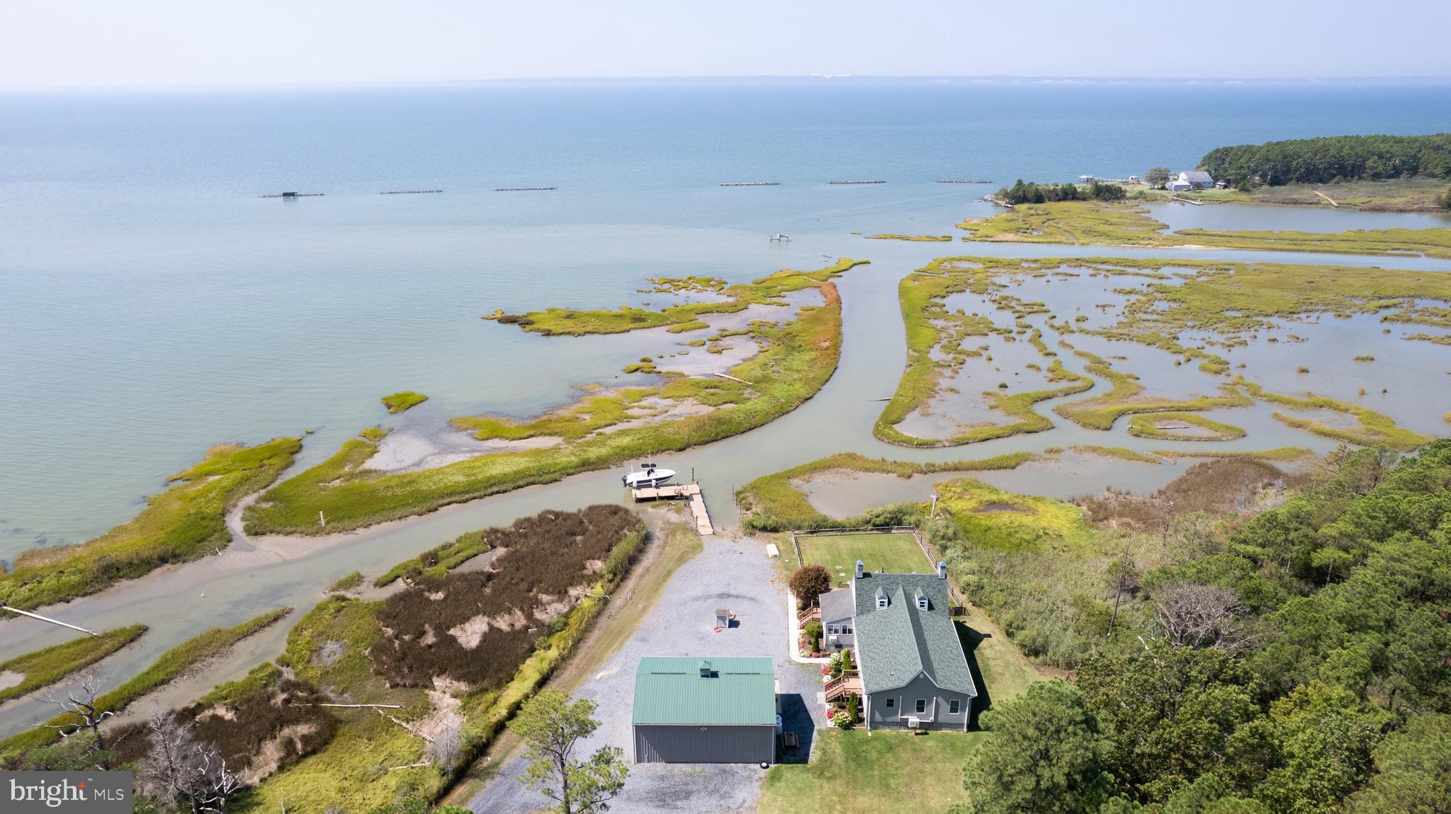 an aerial view of a house with outdoor space