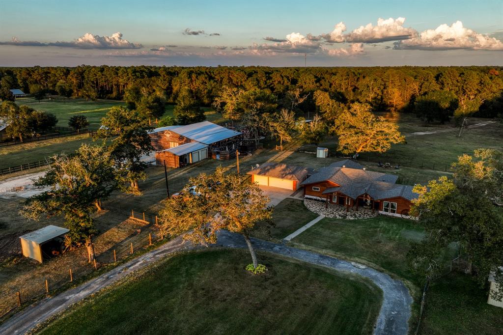 6.4 Unrestricted Acres boasting Home, Event Barn & Stalls for your horses!