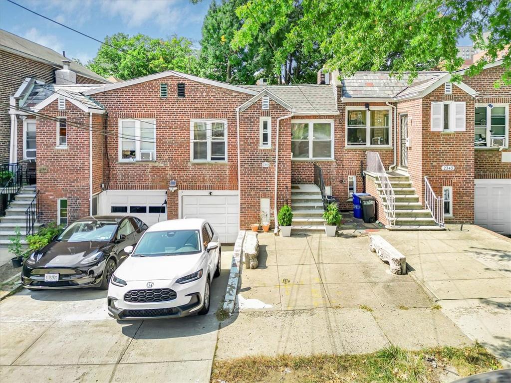 View of front of property featuring a garage