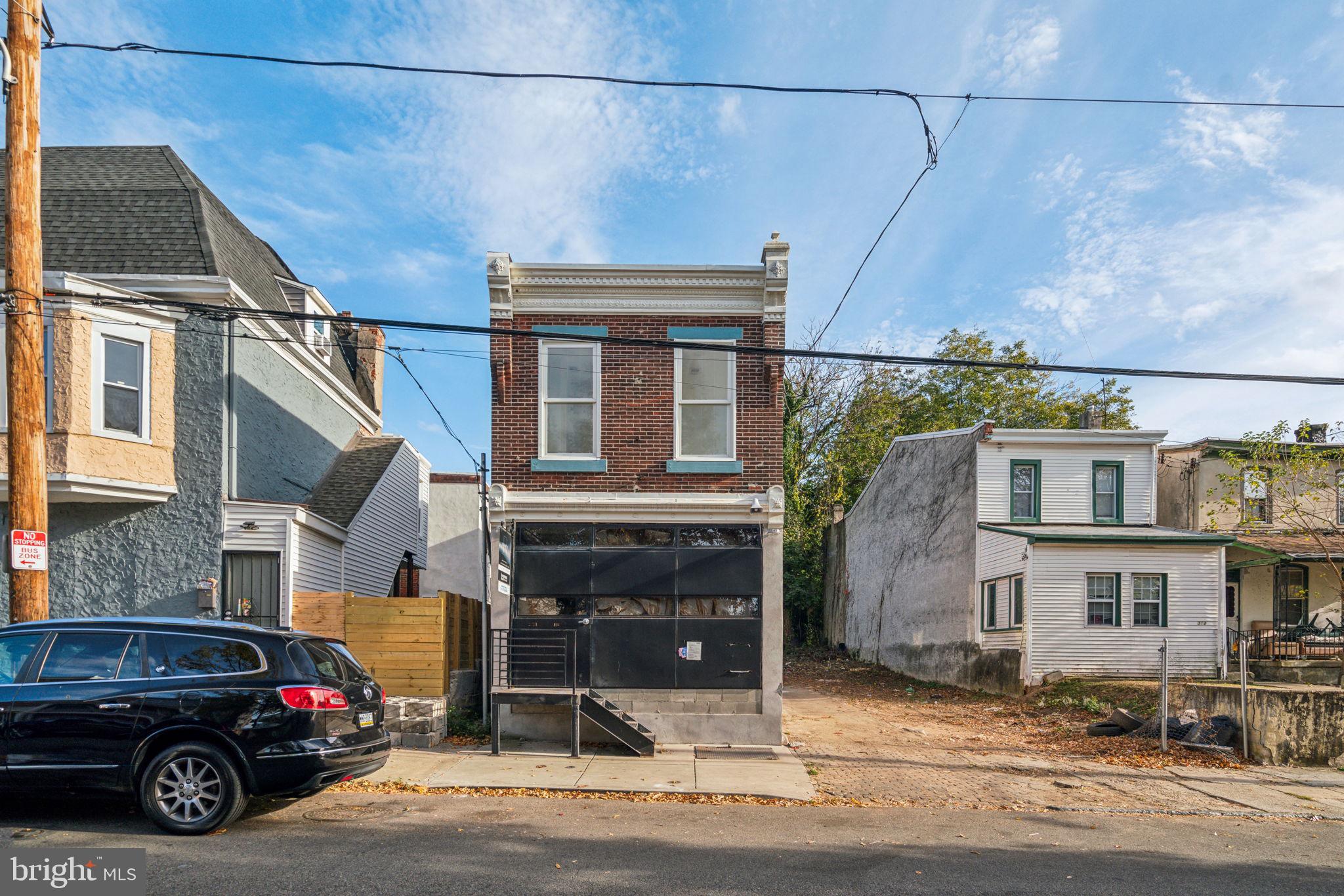 a view of a car parked in front of a house