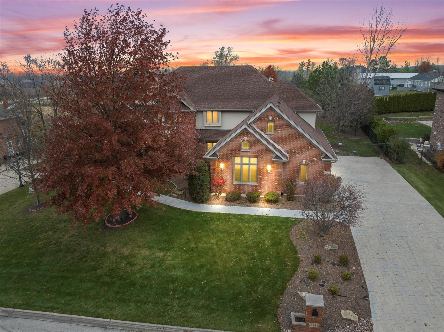 a front view of a house with yard