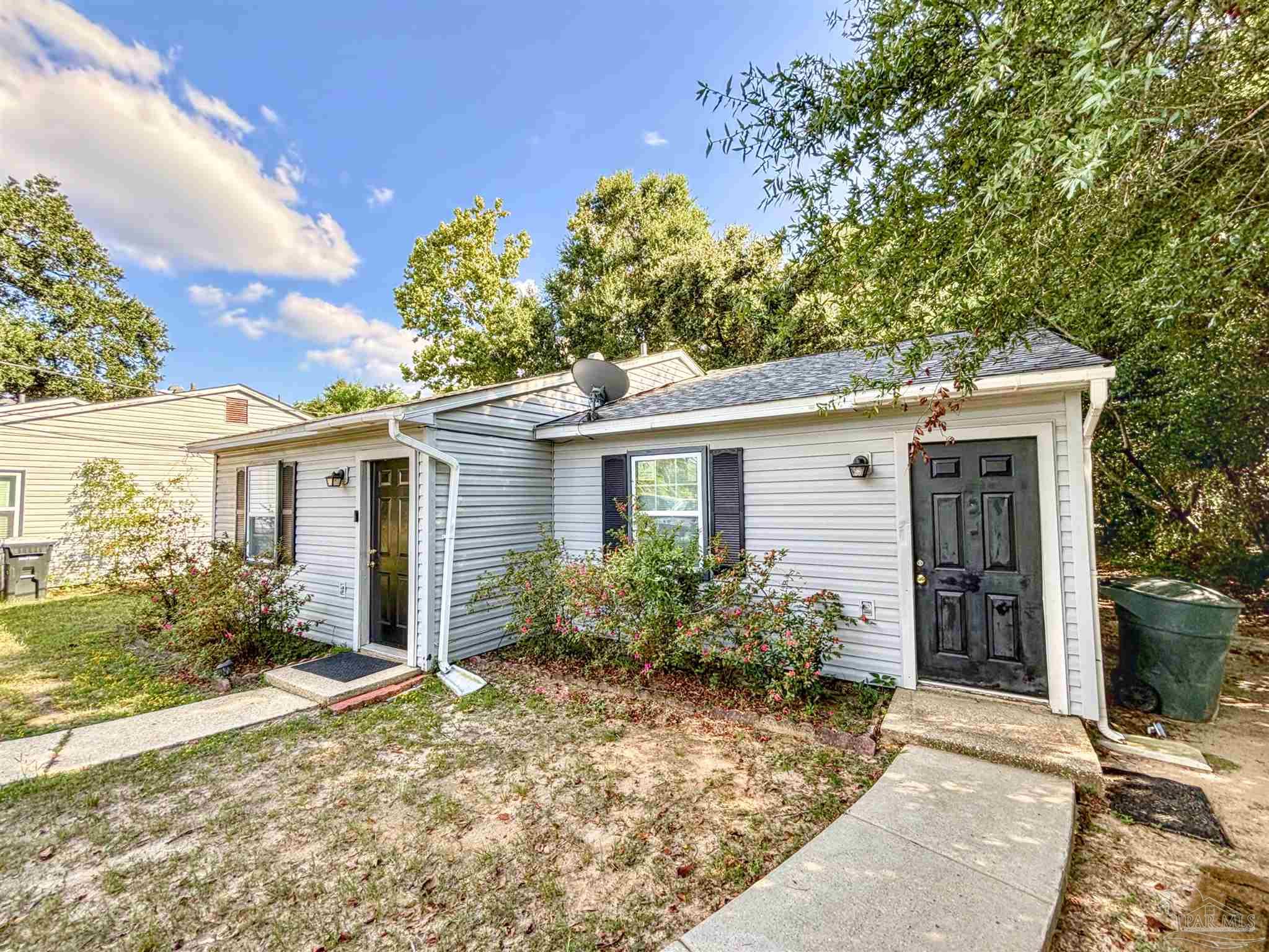 front view of a house with a yard