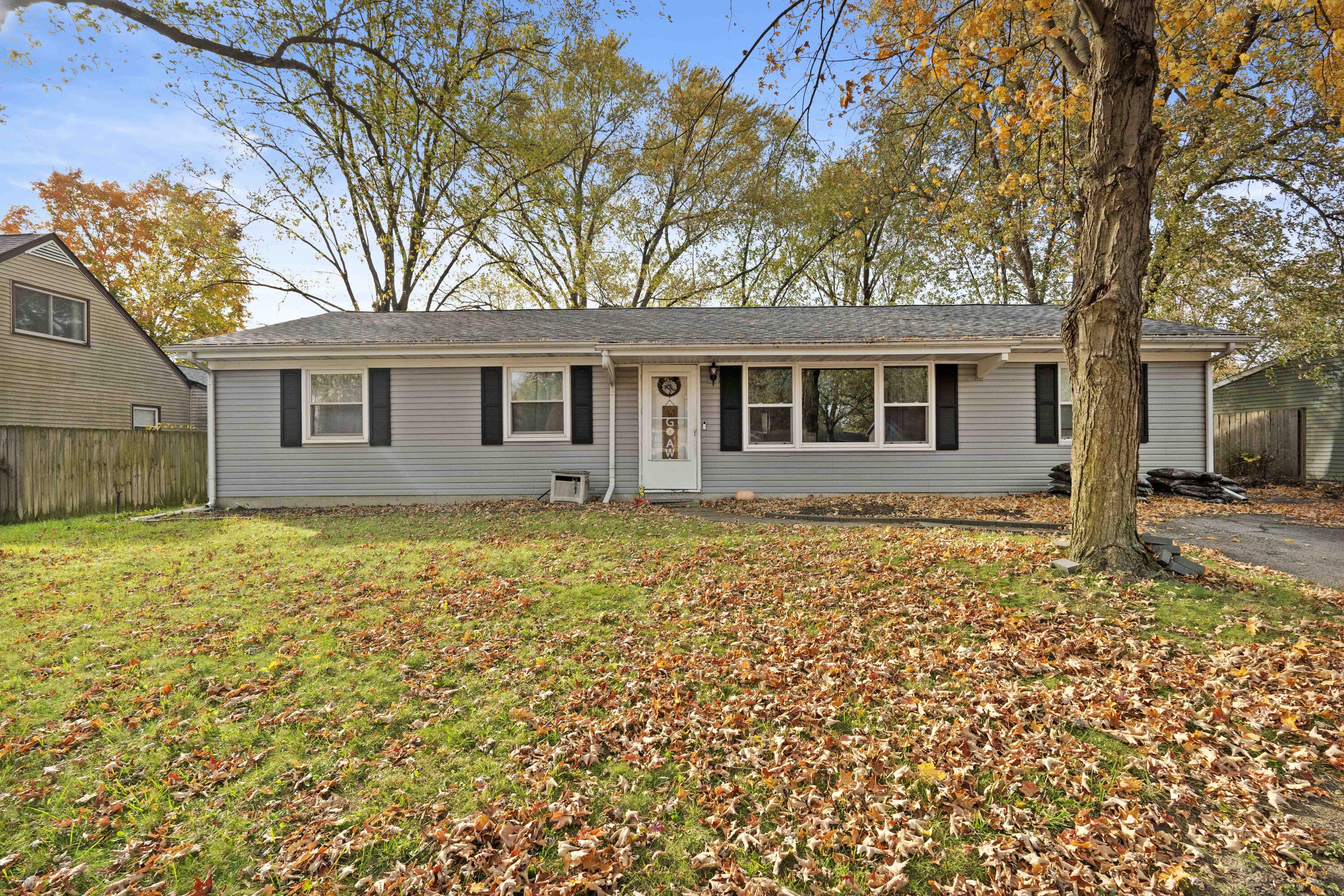 front view of a house with a yard