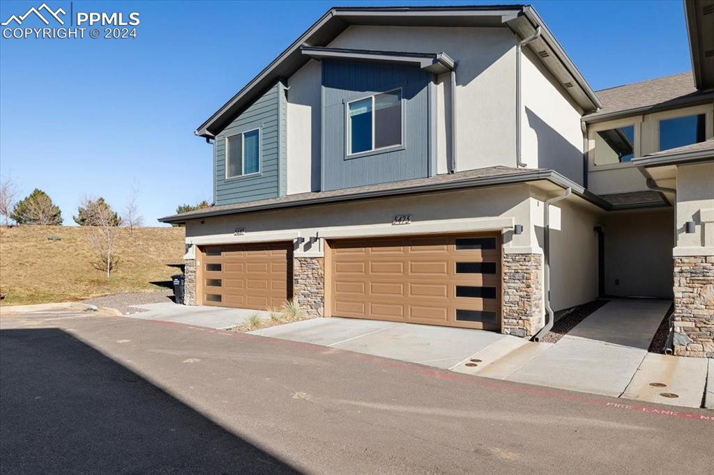 View of front of property with a garage