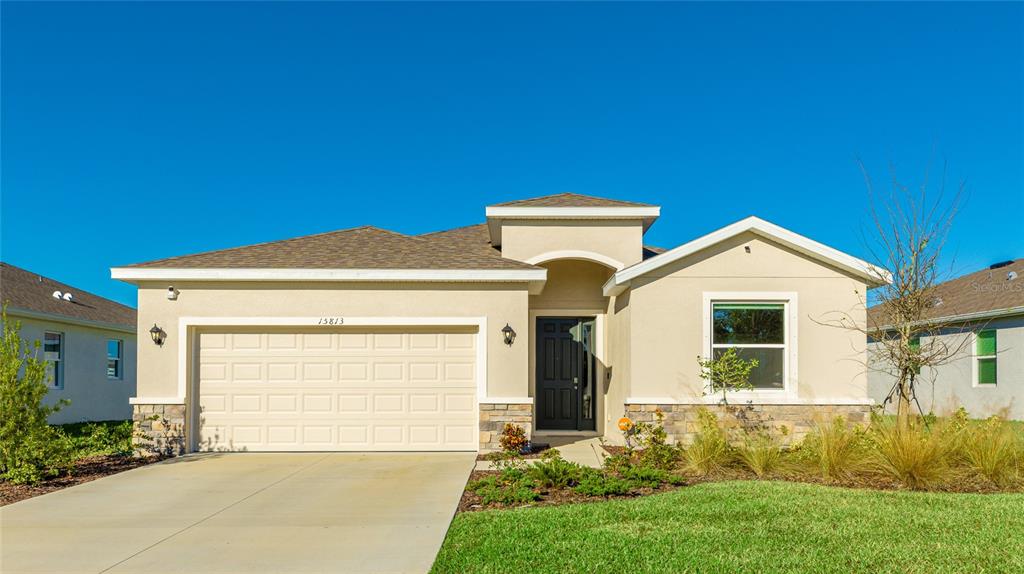 a front view of a house with garden