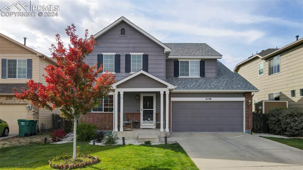 front view of a house with a yard