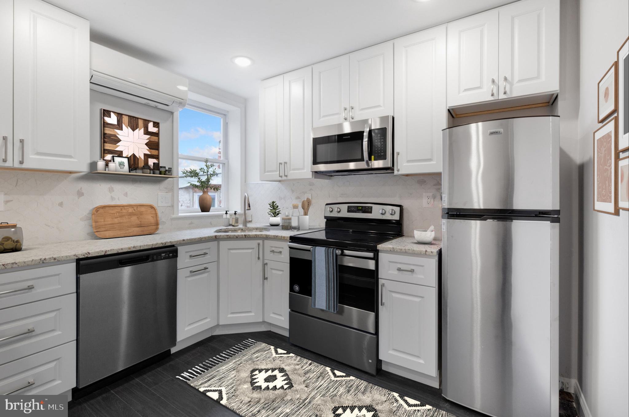 a kitchen with stainless steel appliances granite countertop a refrigerator sink and stove