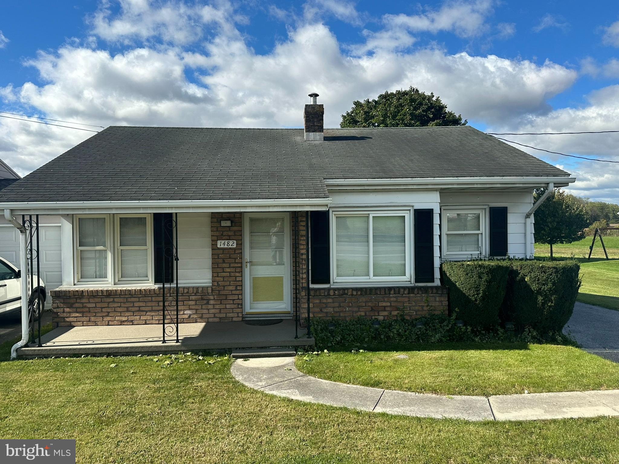 front view of a house with a yard