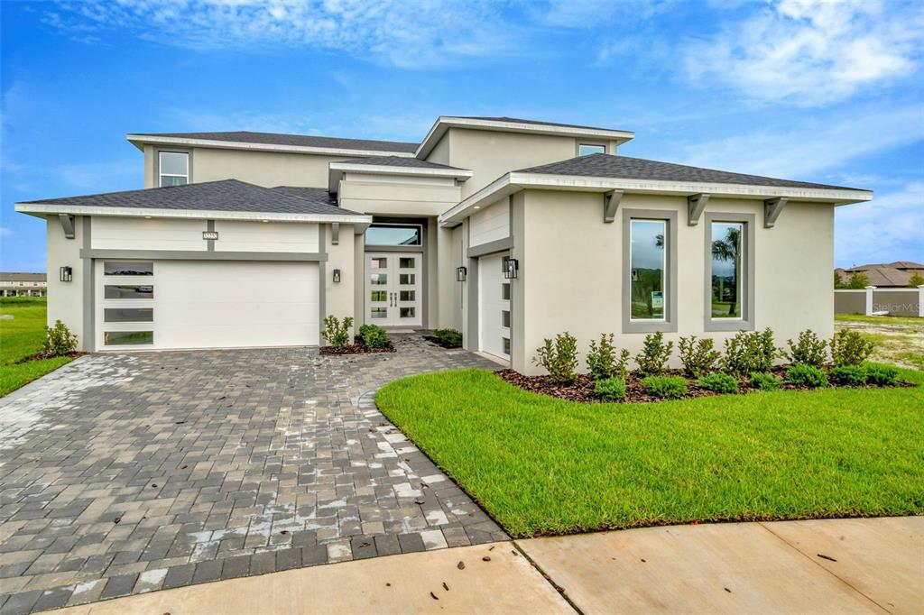 front view of a house with a yard