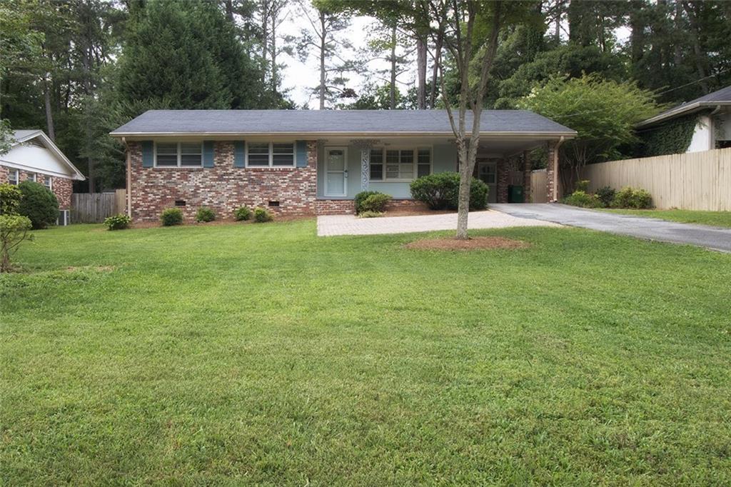 a view of a house with a backyard patio and swimming pool