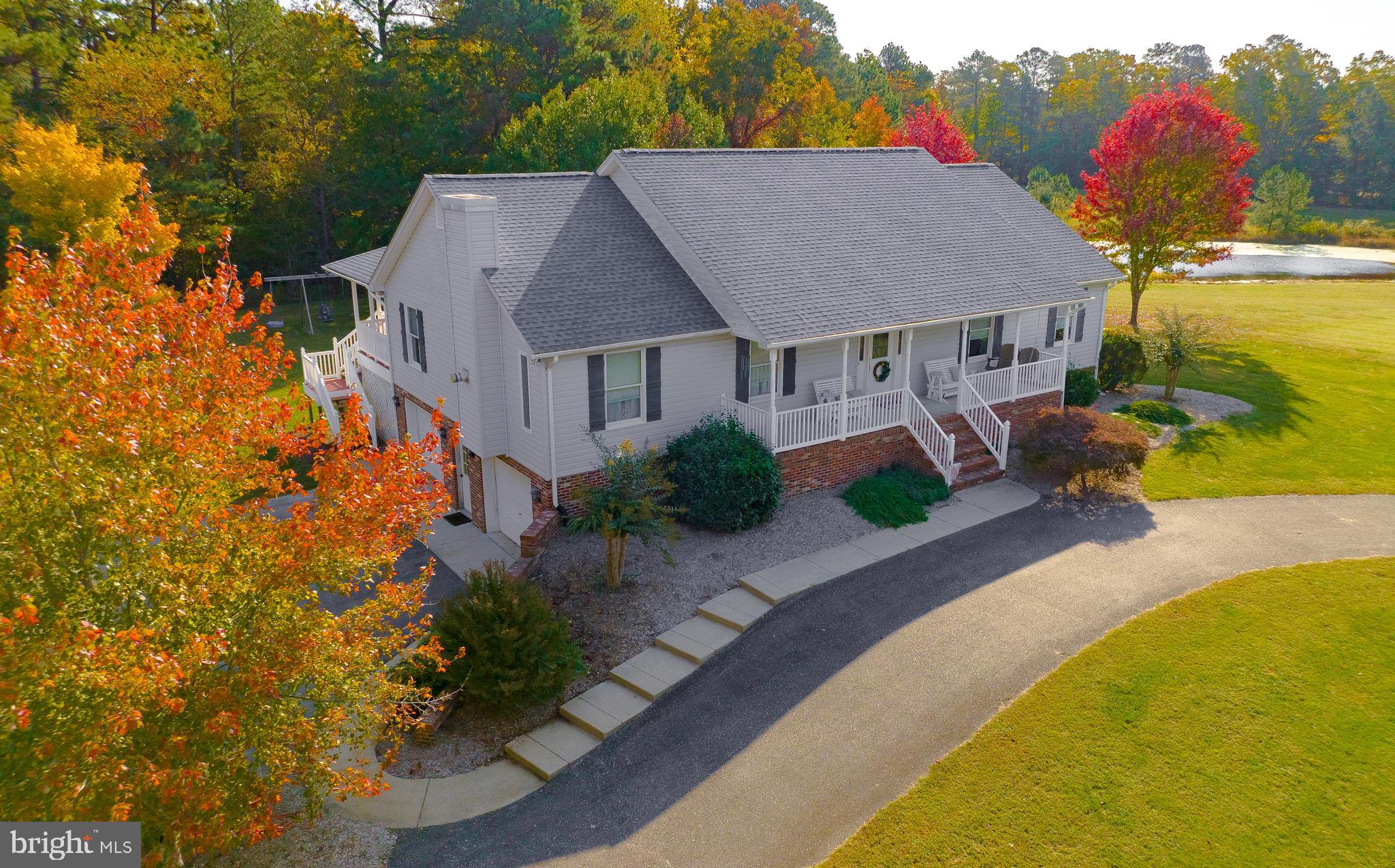 a aerial view of a house with swimming pool and porch