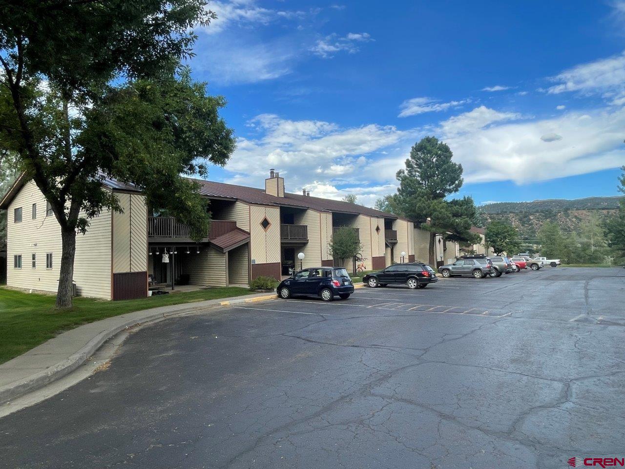 a view of a parked cars in front of a house