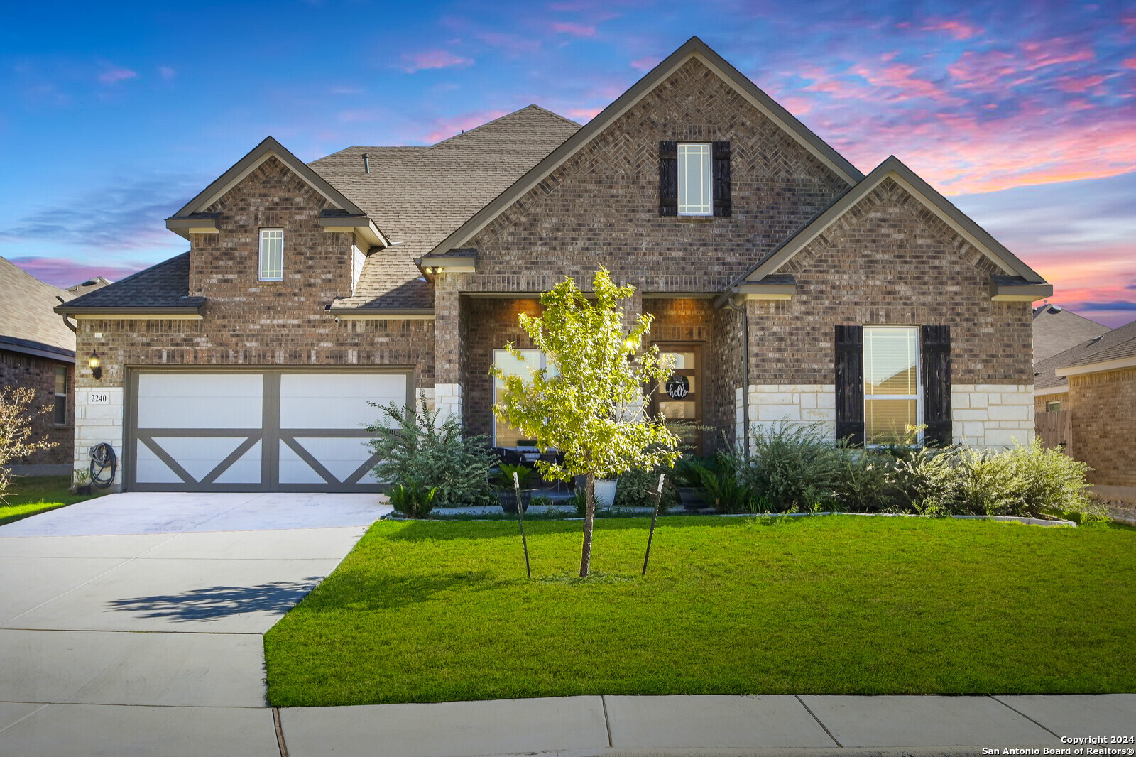 a front view of a house with a yard