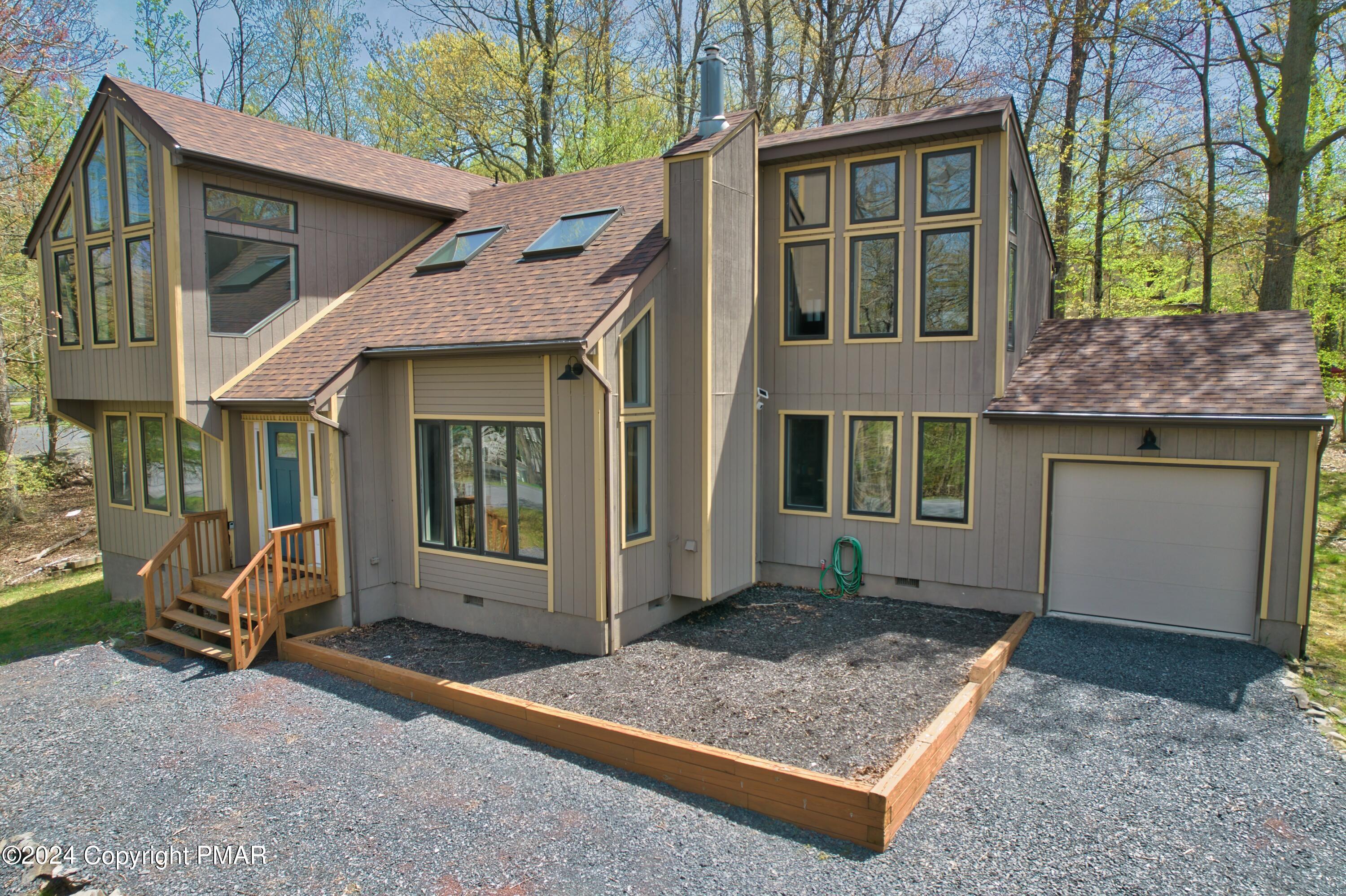 a view of a house with a sink and yard