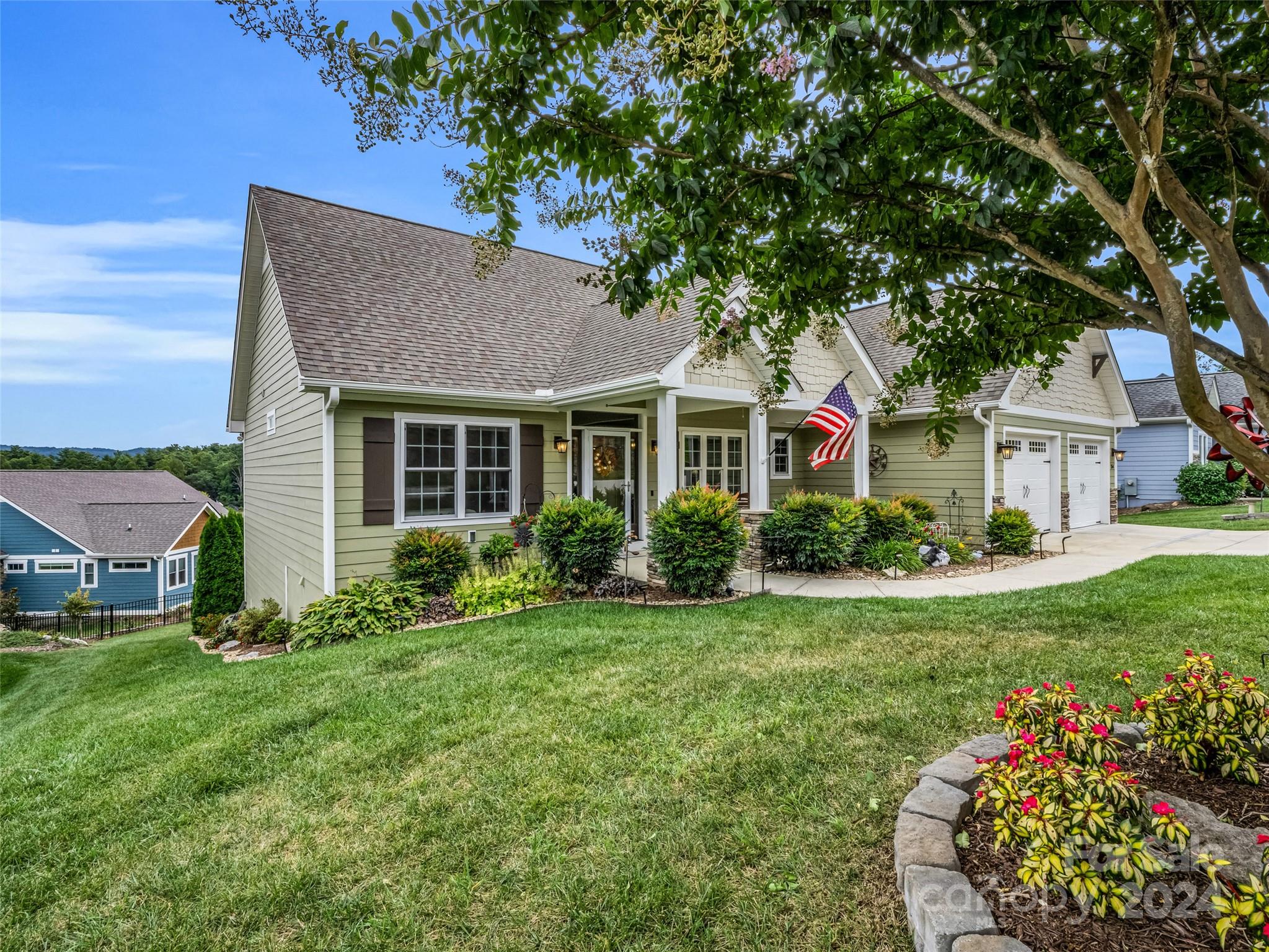 a front view of a house with garden