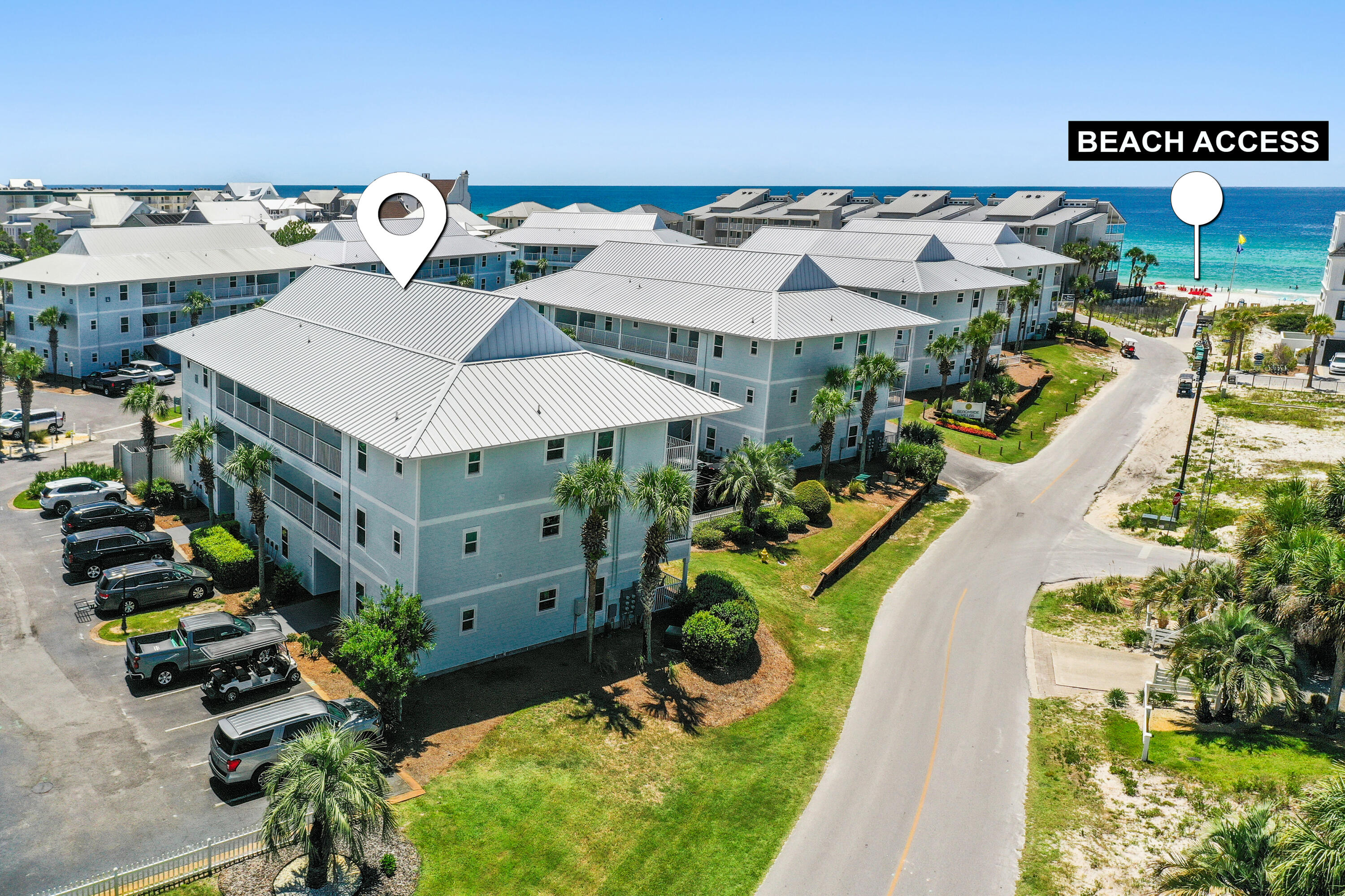 an aerial view of houses with yard