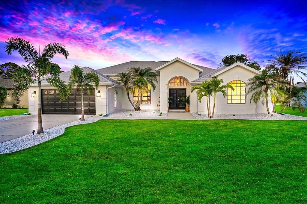 a front view of a house with a yard