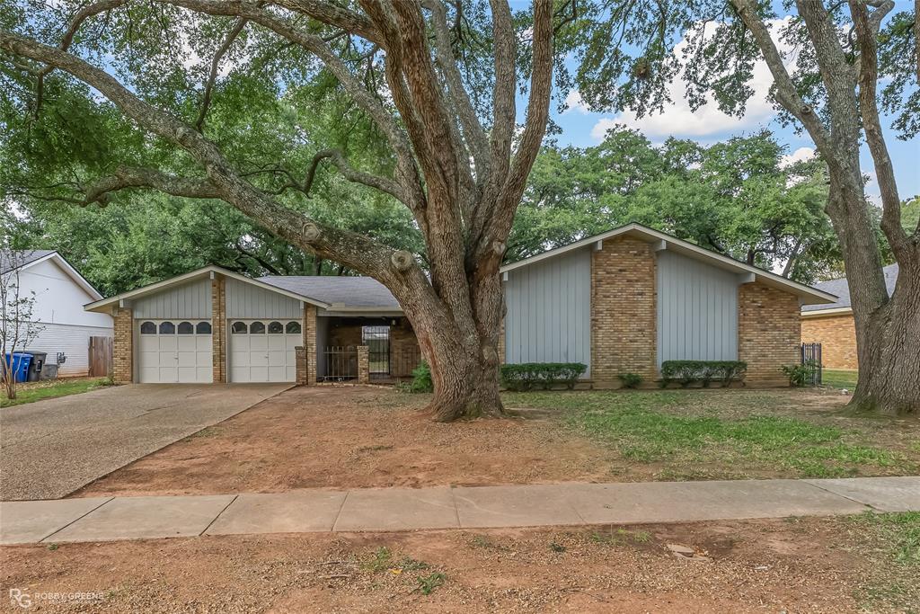 a house with a tree in front of it