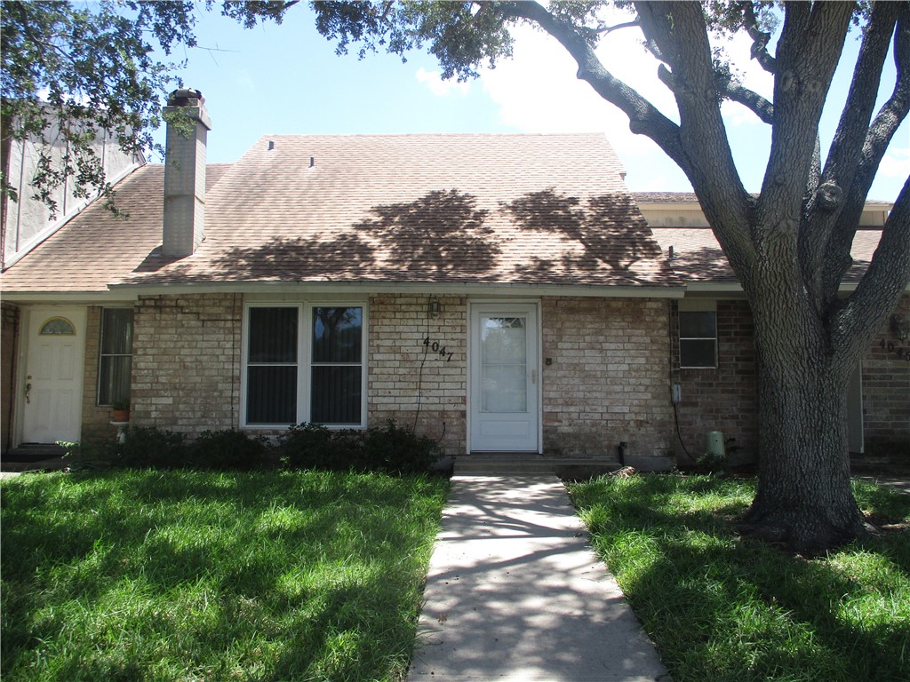 front view of a house with a yard