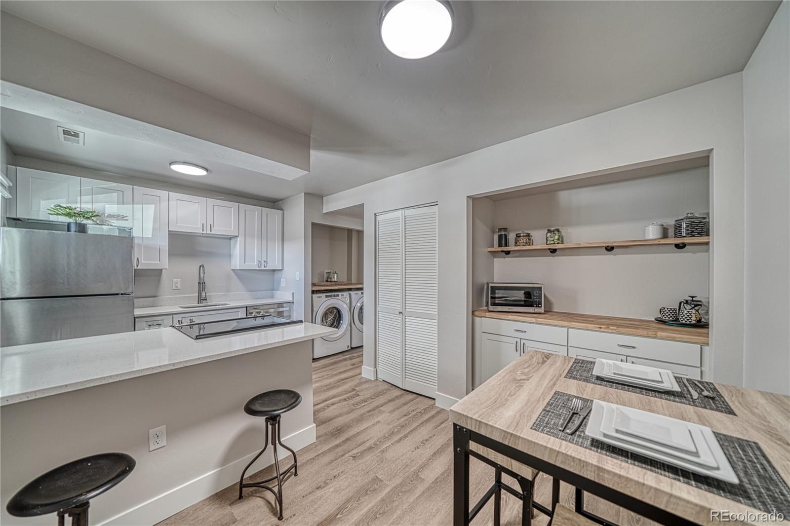 a kitchen with a table and chairs in it