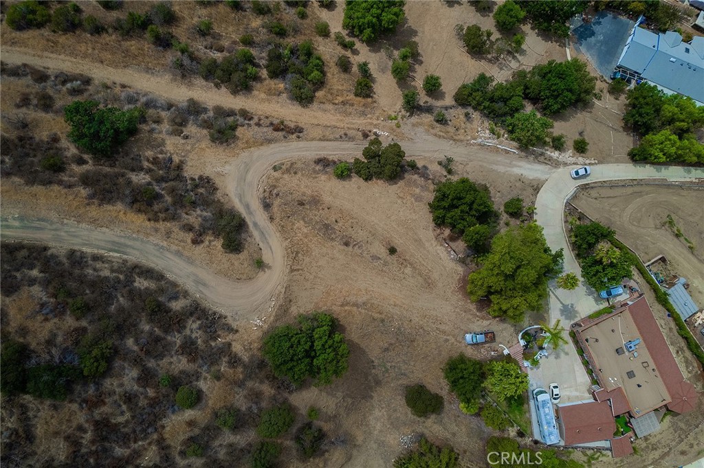 an aerial view of house with a yard