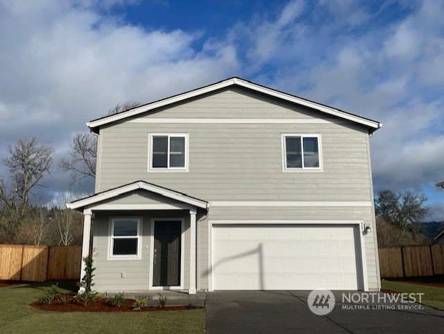 a front view of a house with garage