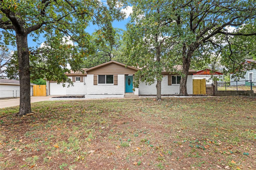 a house with trees in the background