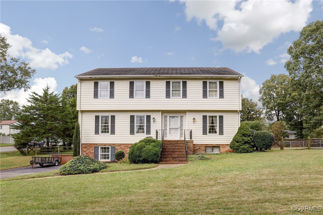 a front view of a house with a yard