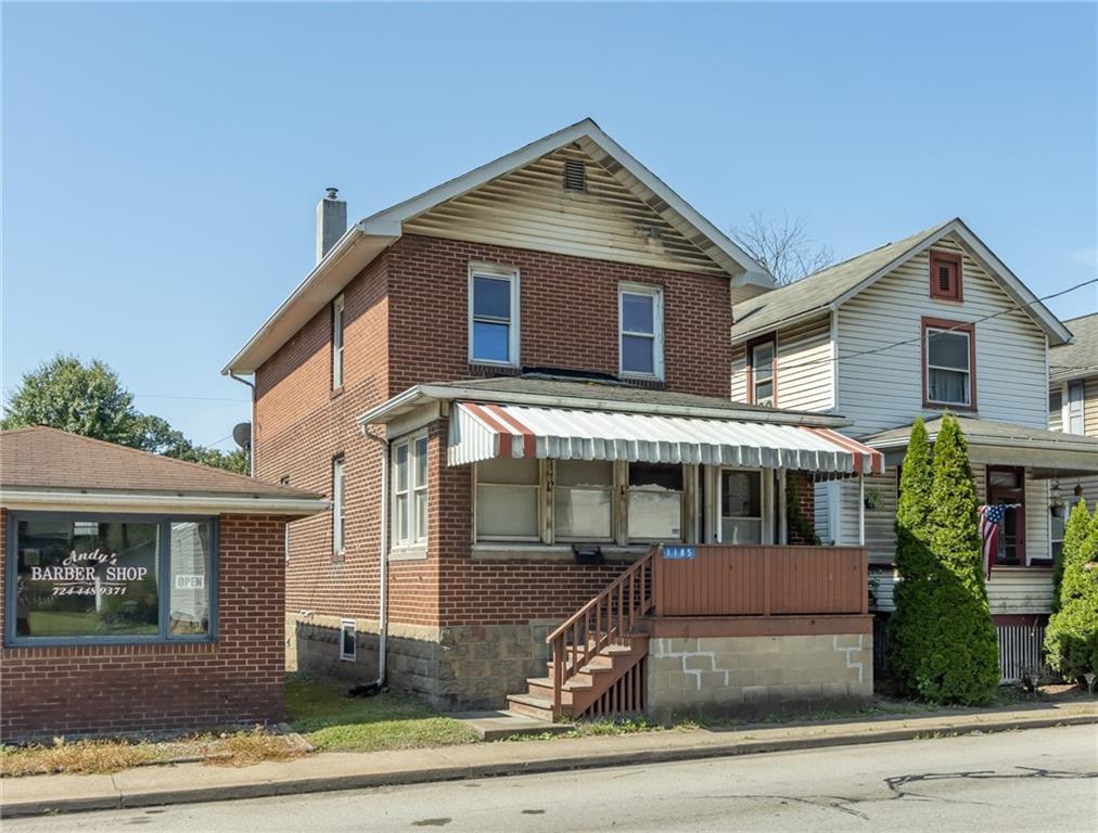 a front view of a house with a porch