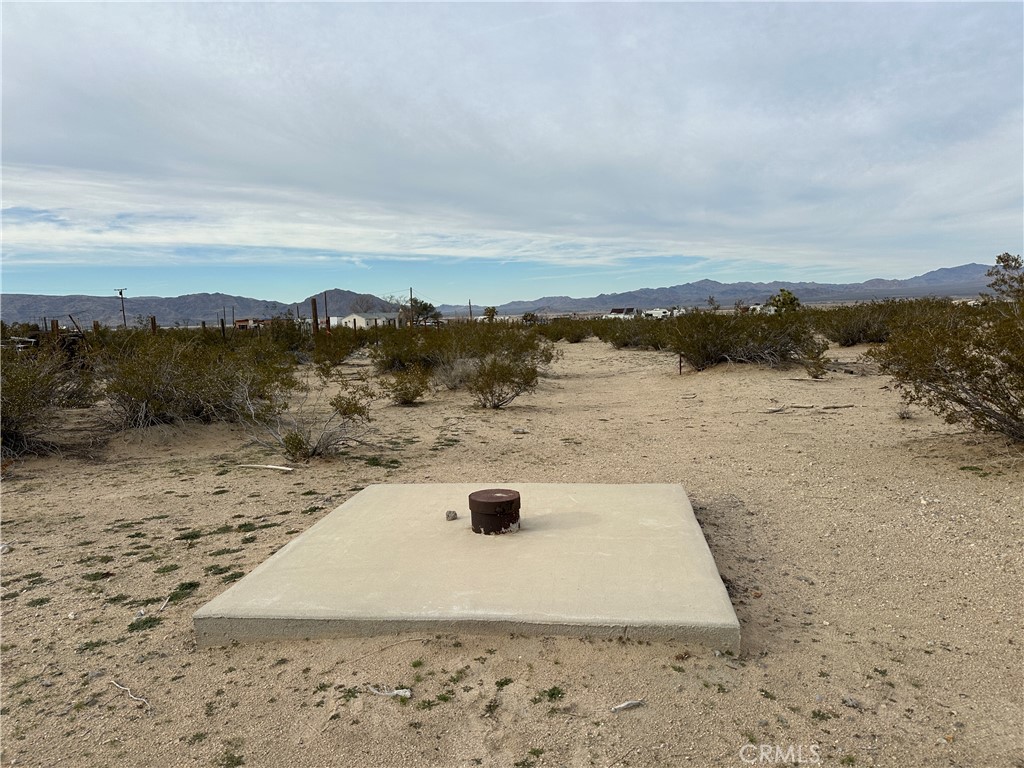 a view of a dry yard with mountain