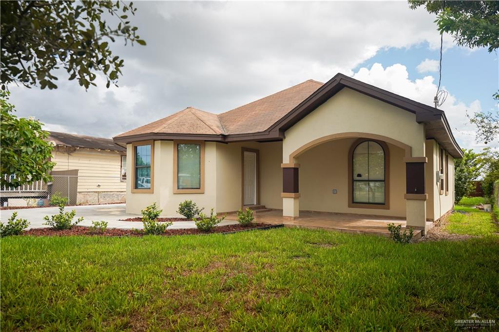 View of front of house with a front lawn