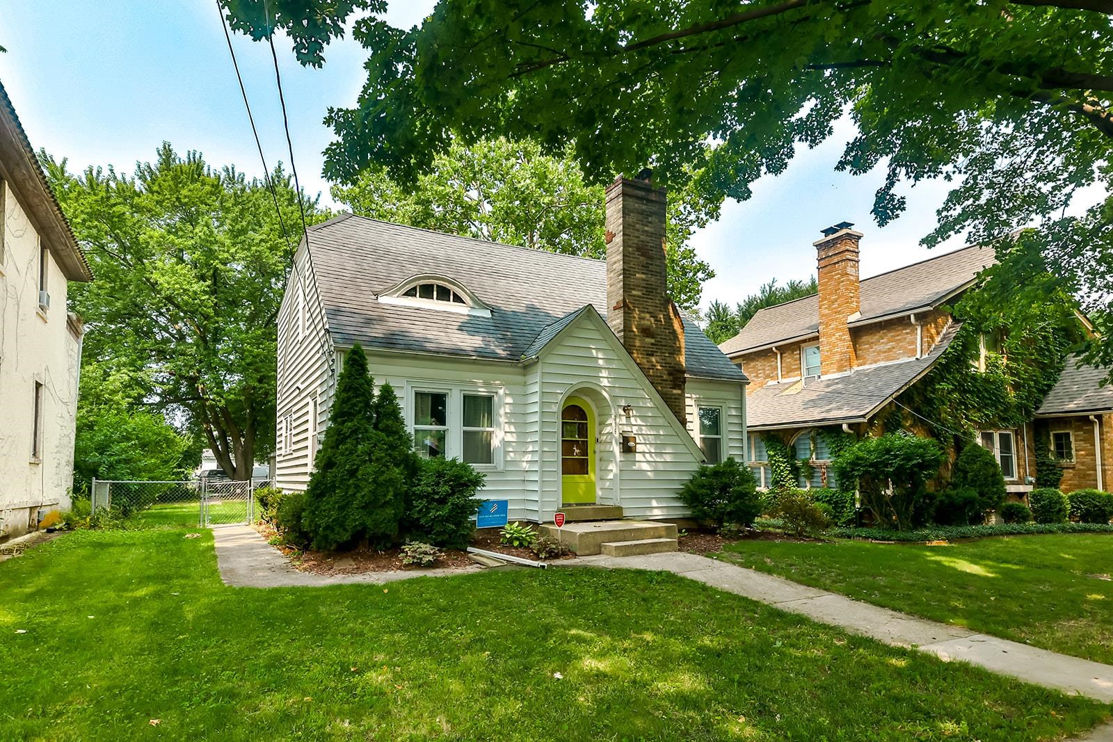 a front view of a house with a yard