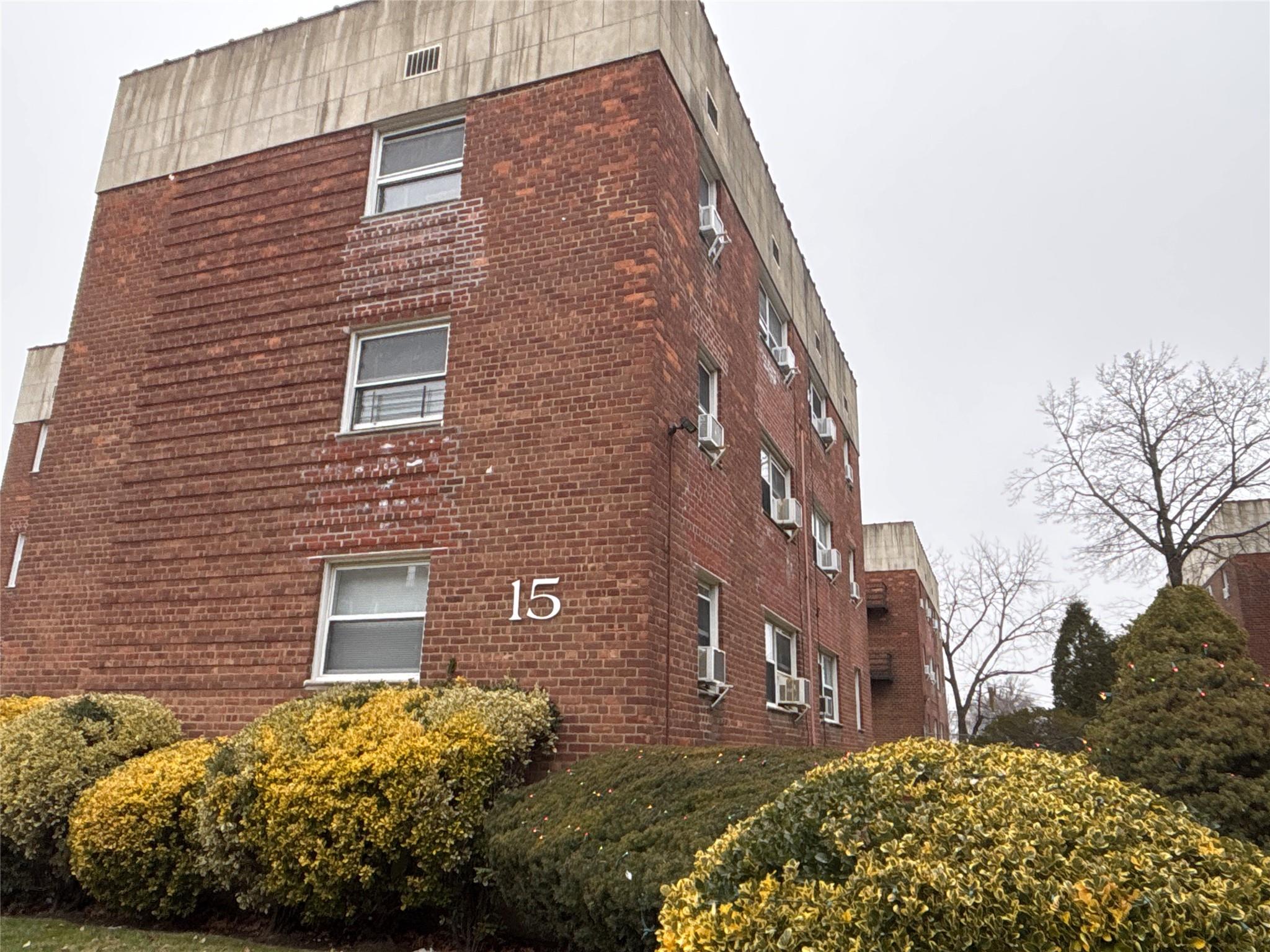 View of building exterior with cooling unit