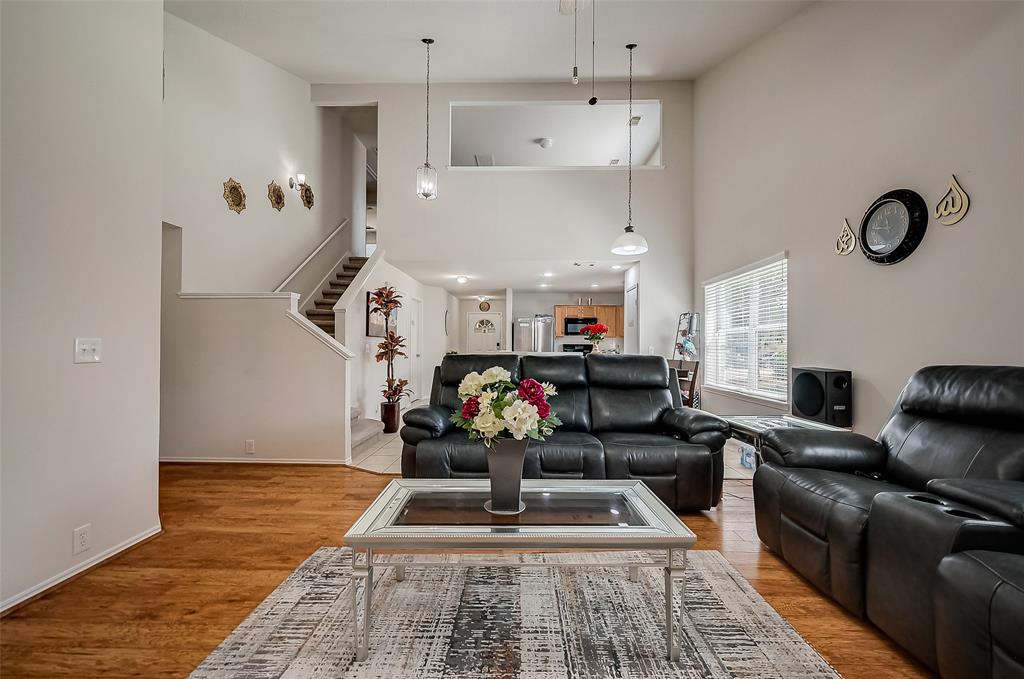 a living room with furniture and a rug